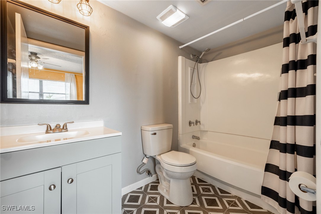 5315 Summerlin Road, Unit 1514 Fort Myers, FL 33919 - Photo 8 of 17 a bathroom with a sink a toilet and shower