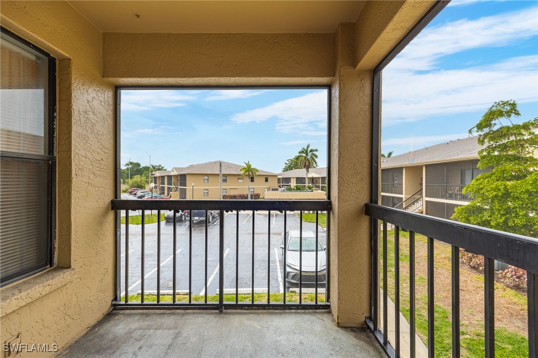 5315 Summerlin Road, Unit 1514 Fort Myers, FL 33919 - Photo 9 of 17 a view of a balcony with a small yard