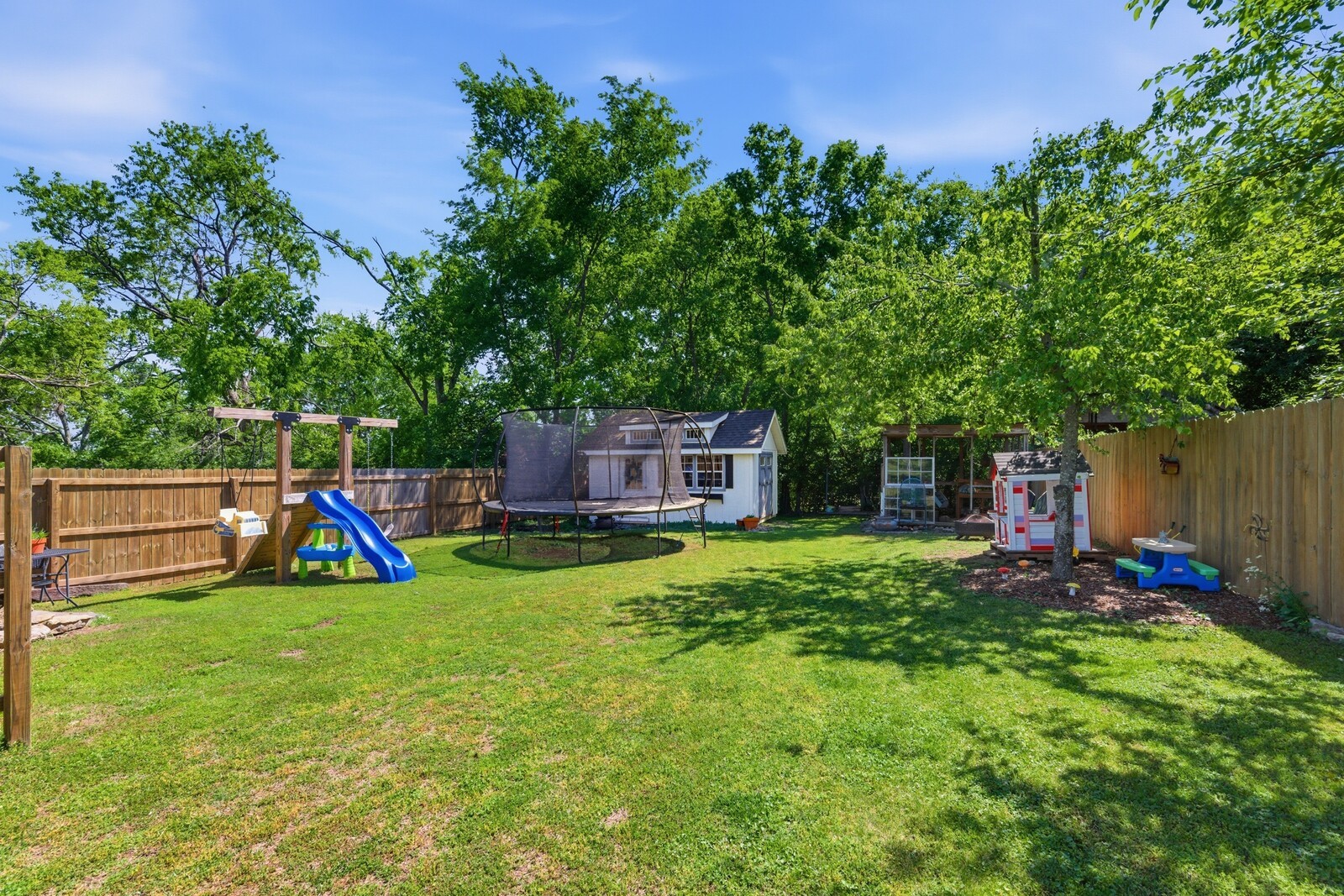 1703 Riverside Drive Nashville, TN 37216 - Photo 26 of 28 a view of a backyard with a barn and a large tree