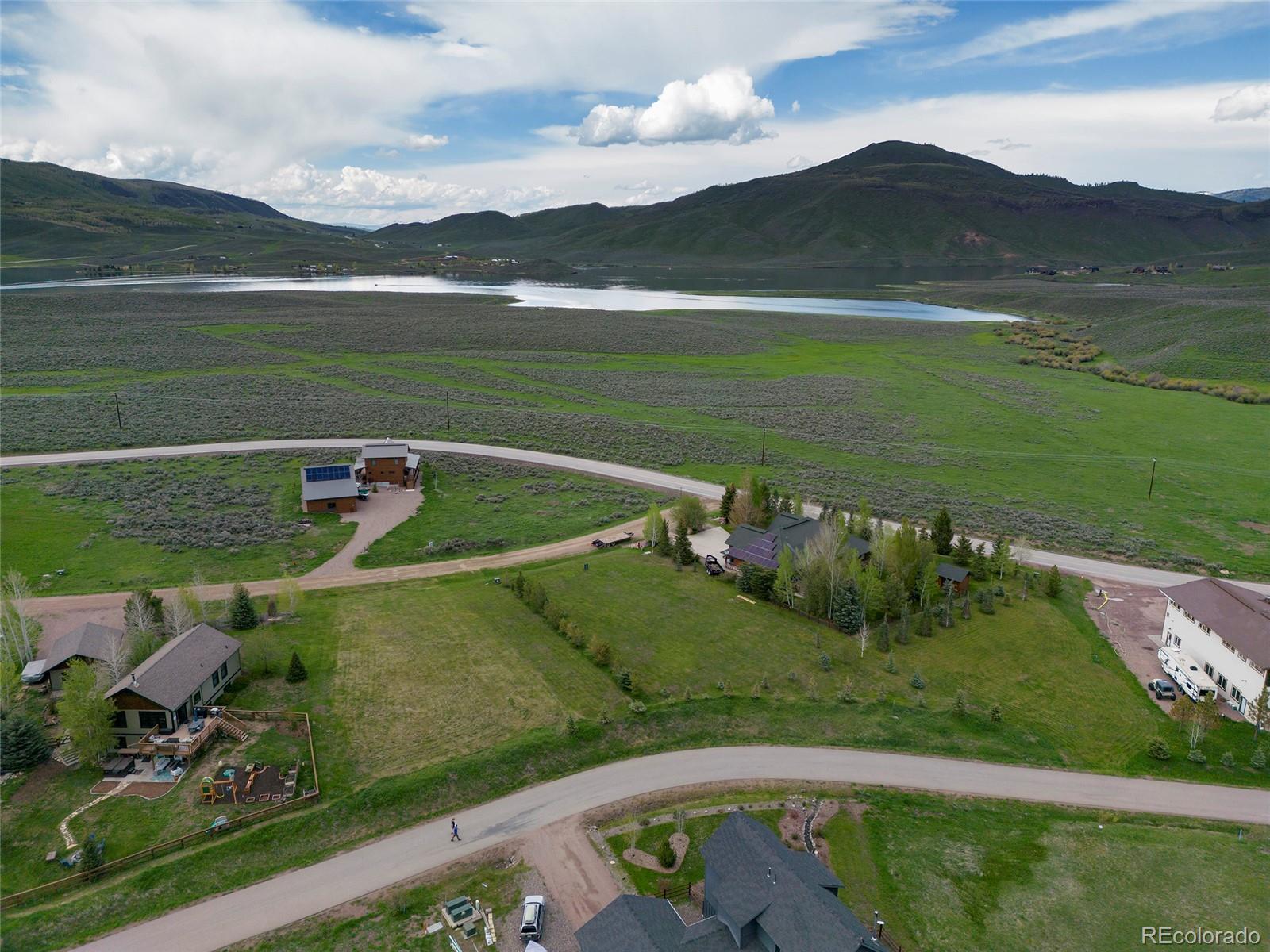 a view of a golf course with a lake