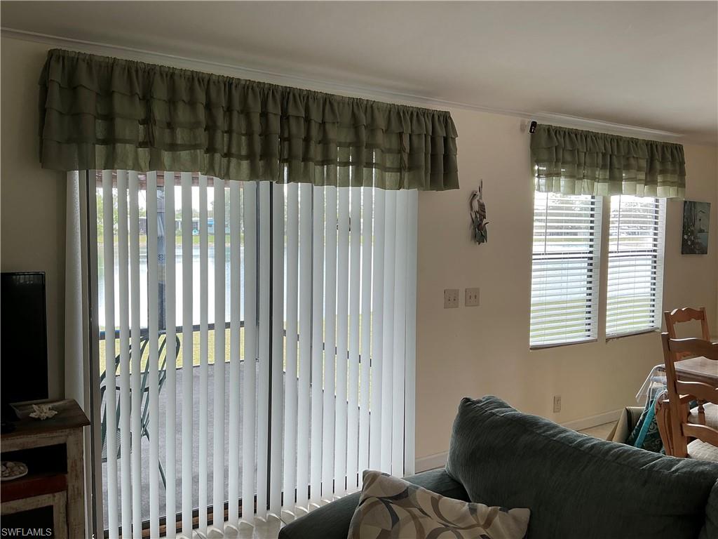 237 Eagle Road, Unit 237 Naples, FL 34114 - Photo 12 of 27 a bedroom with a bed and a window