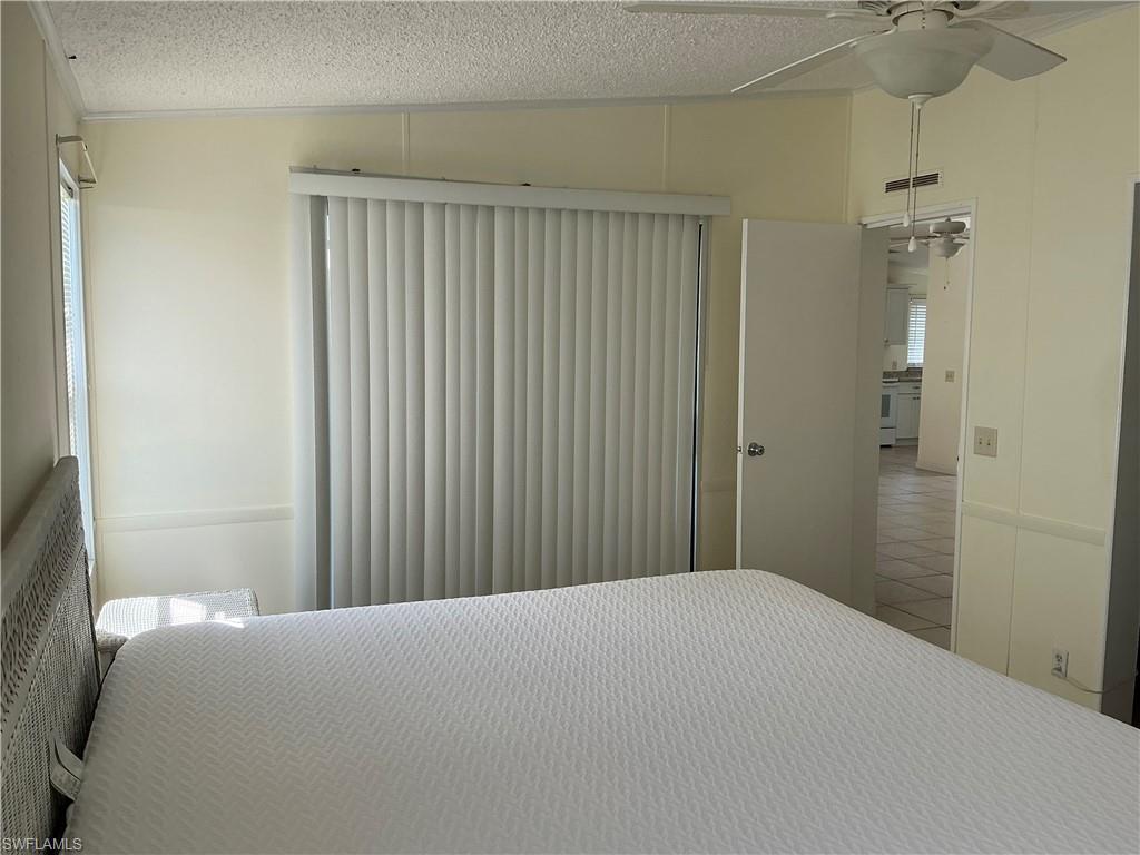 237 Eagle Road, Unit 237 Naples, FL 34114 - Photo 14 of 27 a bedroom with a bed and a shower