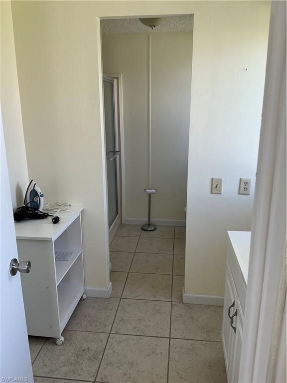 237 Eagle Road, Unit 237 Naples, FL 34114 - Photo 26 of 27 a bathroom with a sink and a mirror