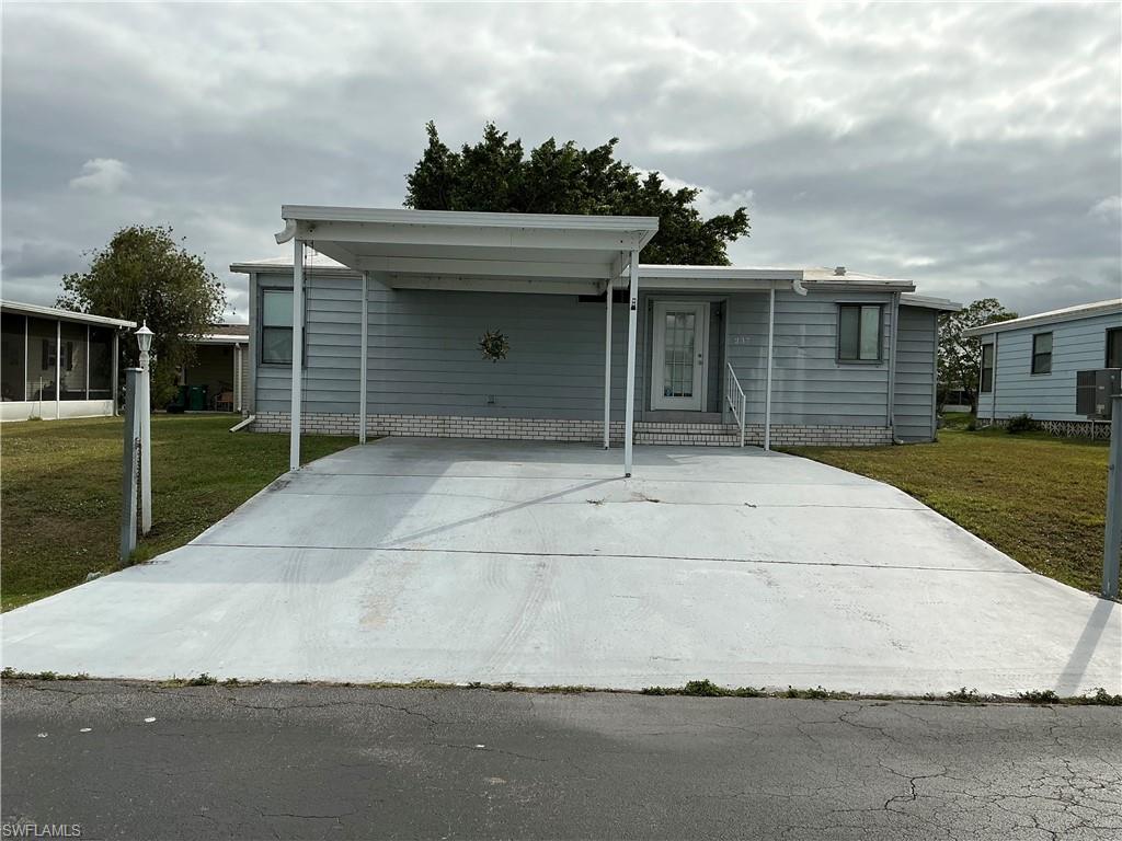 237 Eagle Road, Unit 237 Naples, FL 34114 - Photo 4 of 27 a front view of house with yard