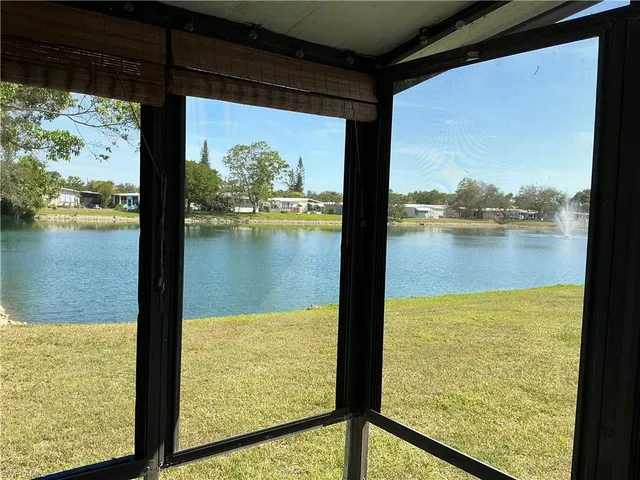 a kitchen with granite countertop a sink stove and cabinets