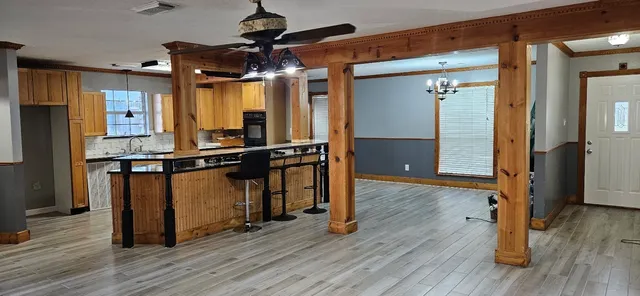 a view of a room with wooden floor