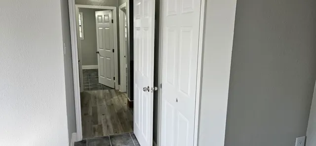 a view of a bathroom from a hallway