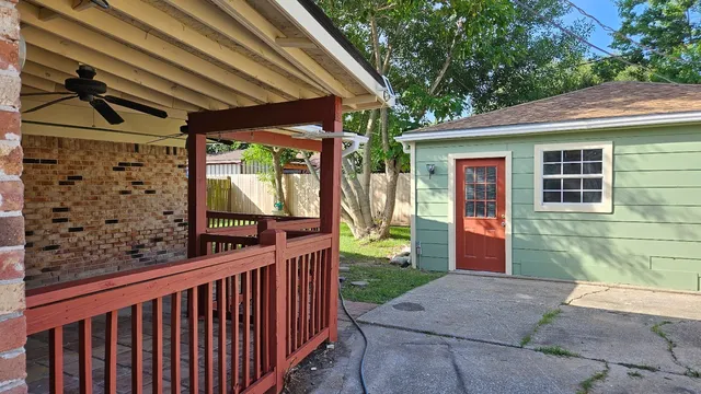 a view of a porch with wooden floor and stairs