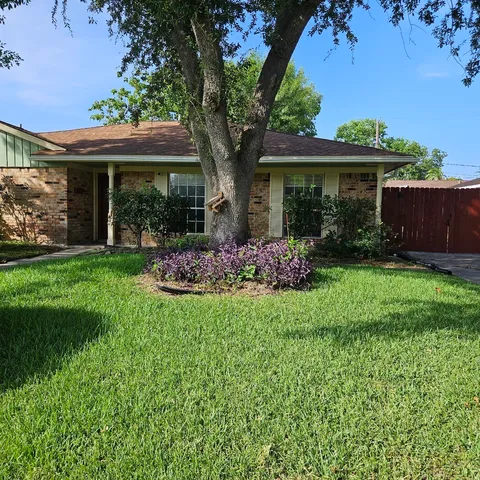 front view of a house with a garden