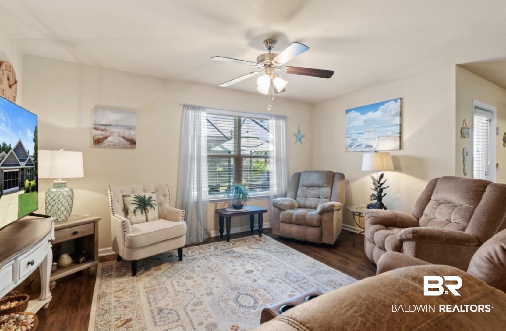 1676 Abbey Loop Foley, AL 36535 - Photo 6 of 31 Living area featuring wood-finish flooring, a ceiling fan with light fixture, and a window with blinds overlooking an outdoor screened enclosure