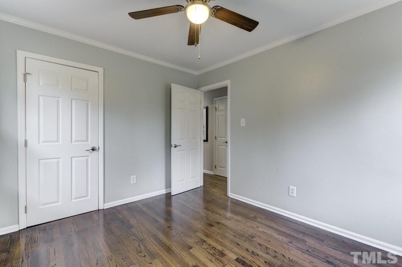 2314 Glascock Street Raleigh, NC 27610 - Photo 16 of 25 a view of an empty room with wooden floor