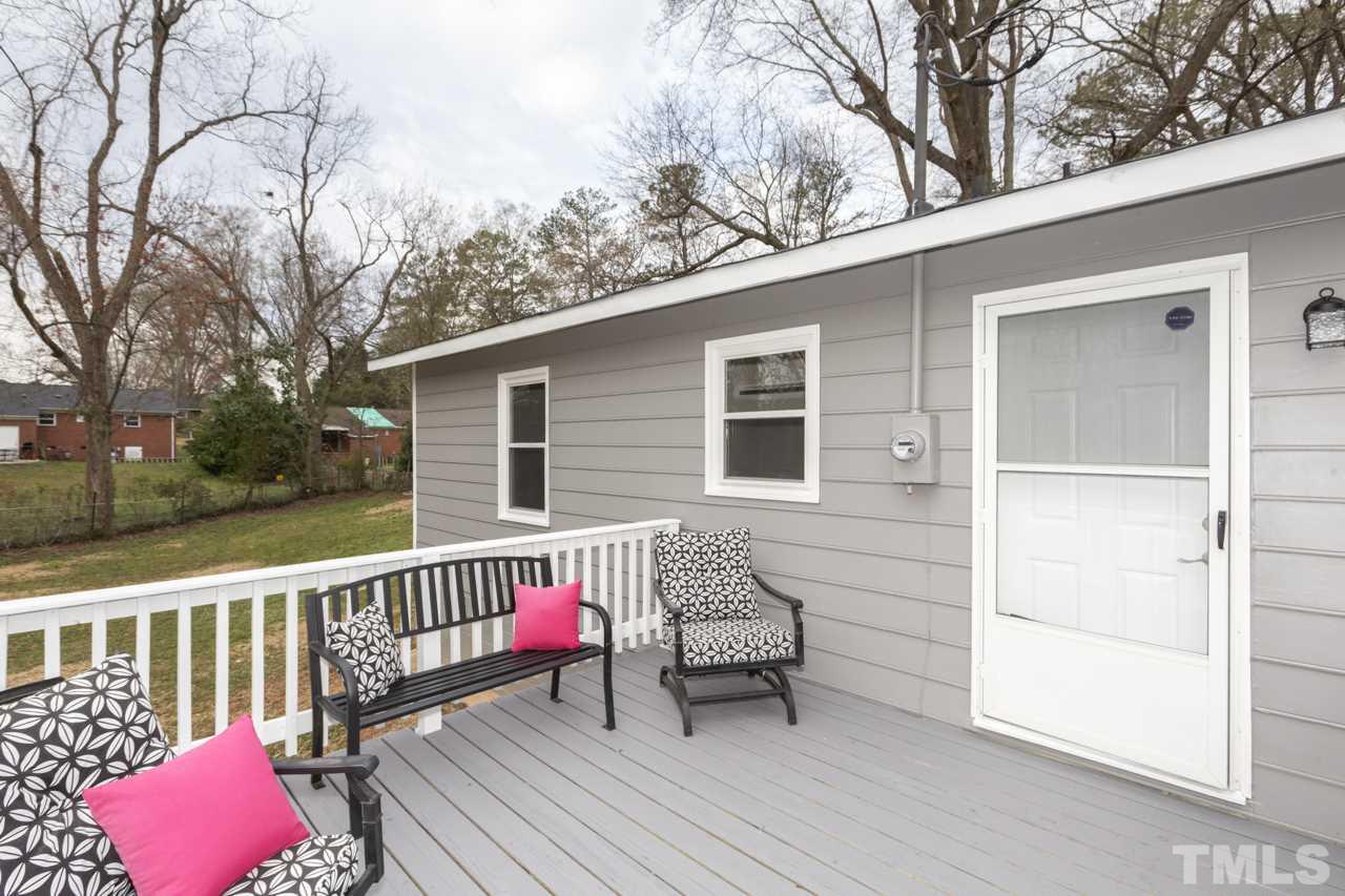 2314 Glascock Street Raleigh, NC 27610 - Photo 22 of 25 a view of a roof deck with wooden floor and fence