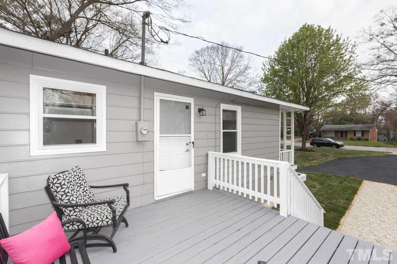 2314 Glascock Street Raleigh, NC 27610 - Photo 23 of 25 a view of a chair and table on the wooden deck