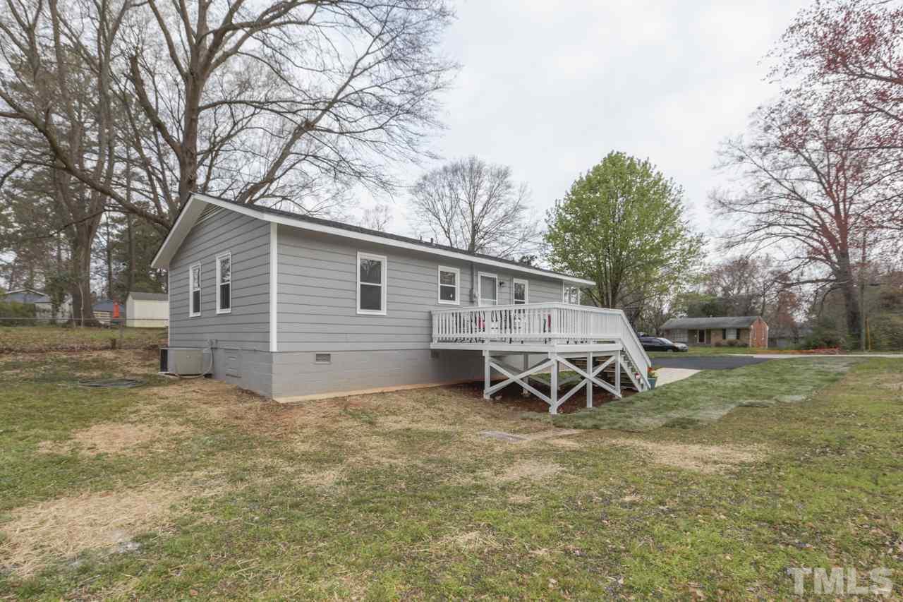 2314 Glascock Street Raleigh, NC 27610 - Photo 25 of 25 a backyard of a house with table and chairs