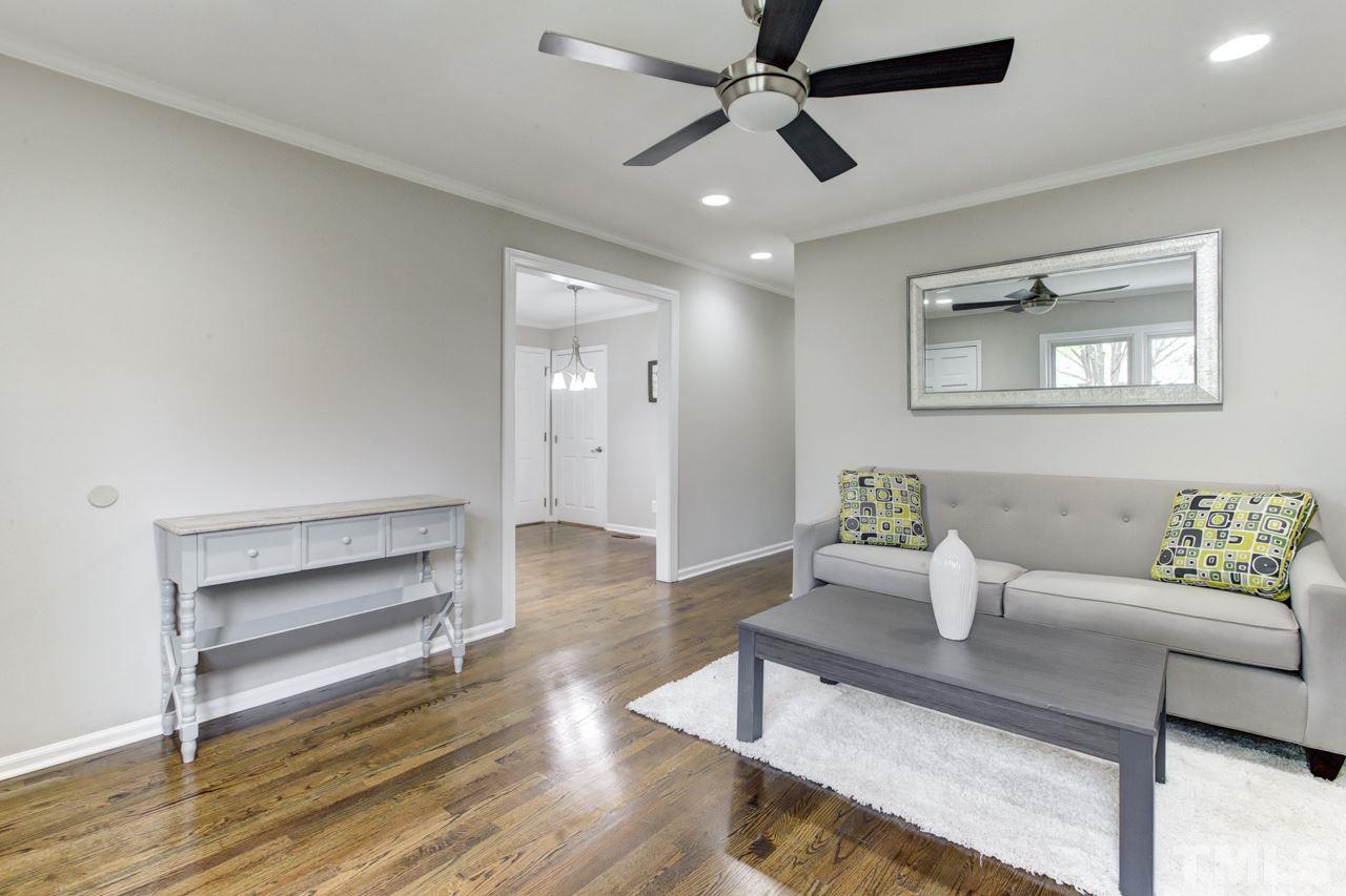 2314 Glascock Street Raleigh, NC 27610 - Photo 5 of 25 a living room with furniture and a ceiling fan