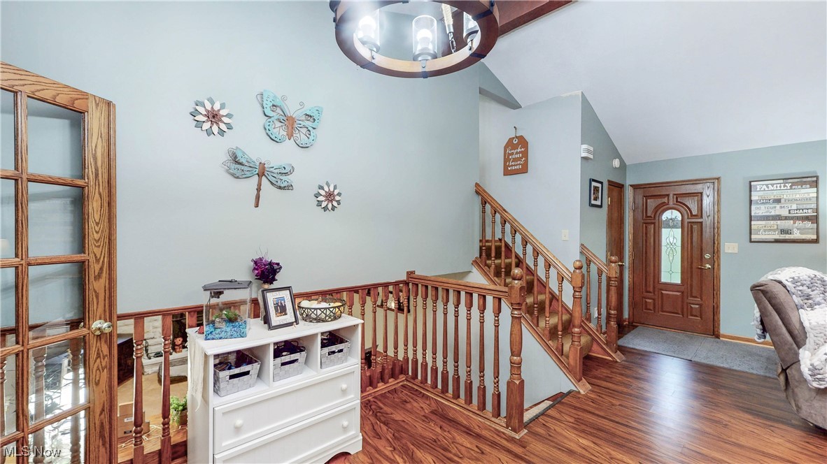 3123 Clearview Road Ravenna, OH 44266 - Photo 15 of 44 Foyer entrance featuring wood finished floors, high vaulted ceiling, and stairway