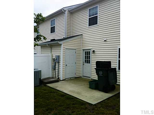 5131 Thornton Knoll Way Raleigh, NC 27616 - Photo 18 of 18 Roomy patio in back with a privacy wall and storage room.