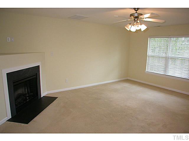 5131 Thornton Knoll Way Raleigh, NC 27616 - Photo 5 of 18 You will also find a ceiling fan and electric corner fireplace with TV niche.