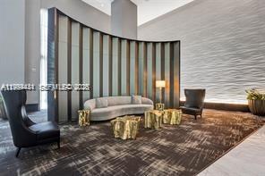 951 Brickell Avenue, Unit 3002 Miami, FL 33131 - Photo 20 of 25 a living room with furniture rug and a fireplace