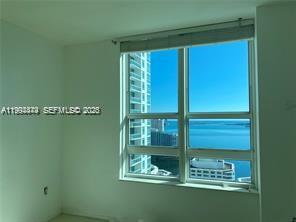 951 Brickell Avenue, Unit 3002 Miami, FL 33131 - Photo 4 of 25 view of a room with window