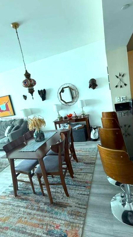 951 Brickell Avenue, Unit 3002 Miami, FL 33131 - Photo 9 of 25 a living room with chairs and a table