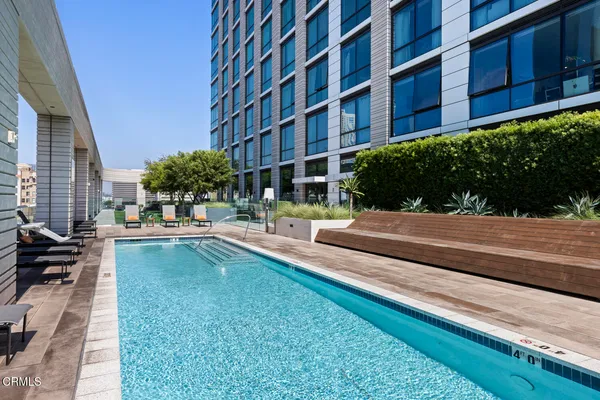 a view of a swimming pool with a patio