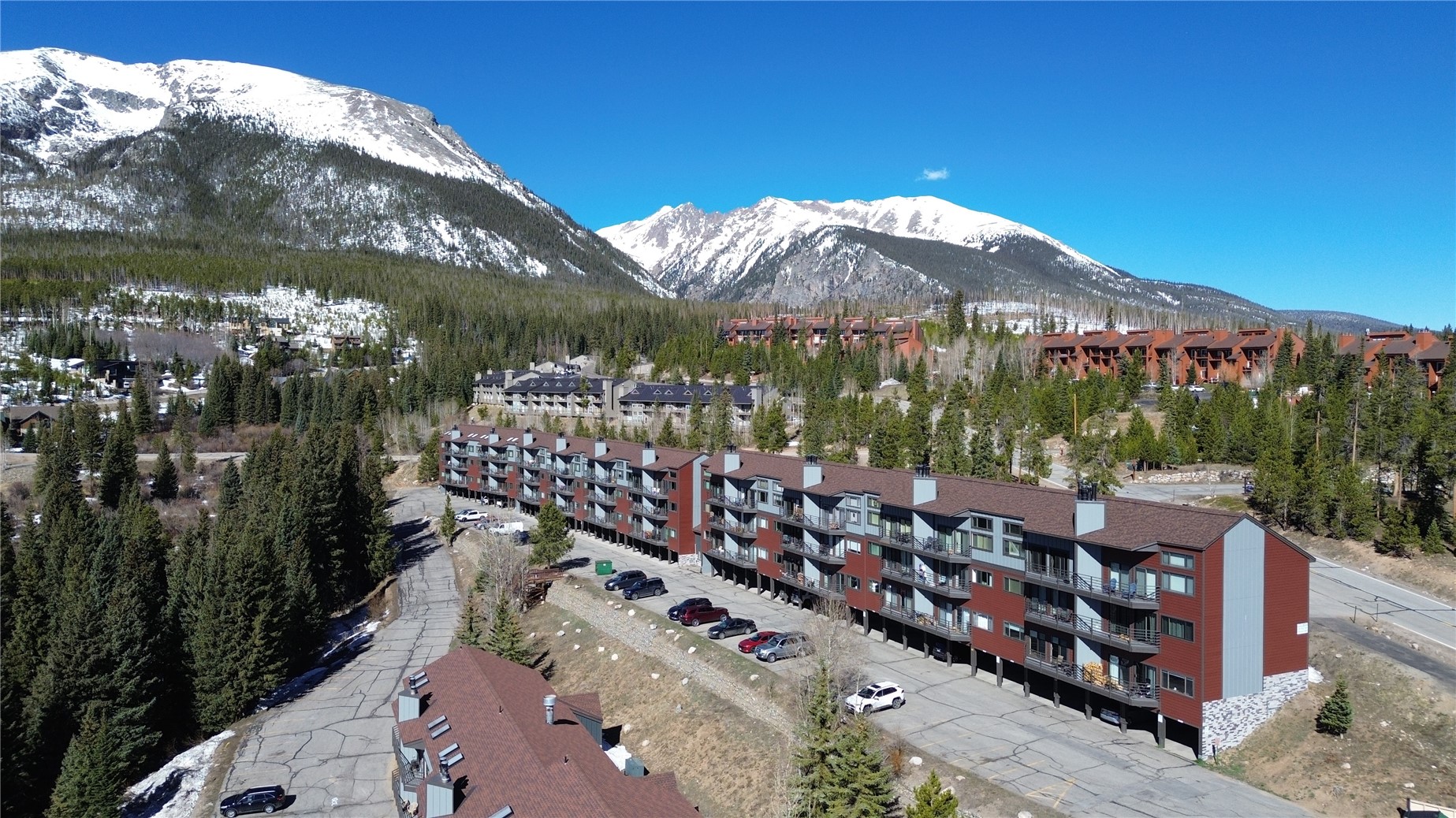 9800 Ryan Gulch Road, Unit 108 Silverthorne, CO 80498 - Photo 1 of 33 a view of a house with a yard from a balcony