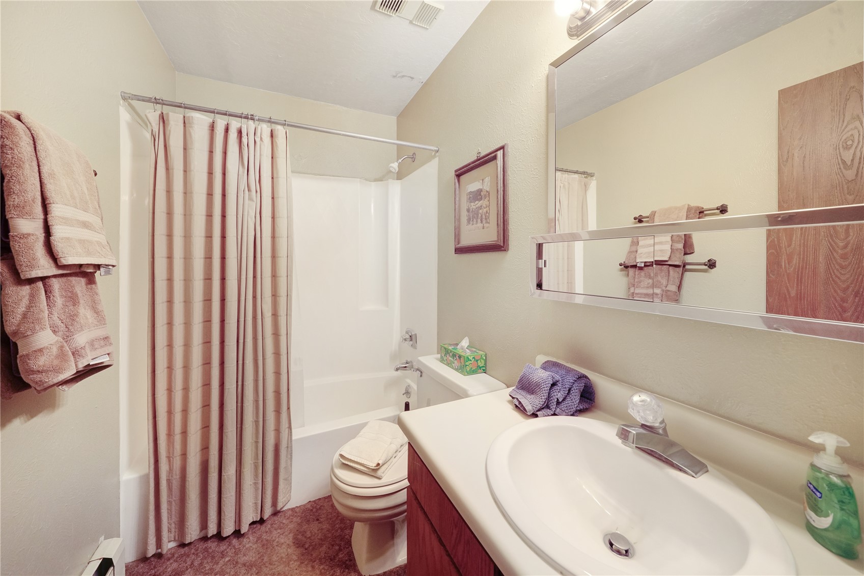 9800 Ryan Gulch Road, Unit 108 Silverthorne, CO 80498 - Photo 24 of 33 a bathroom with a sink toilet and shower