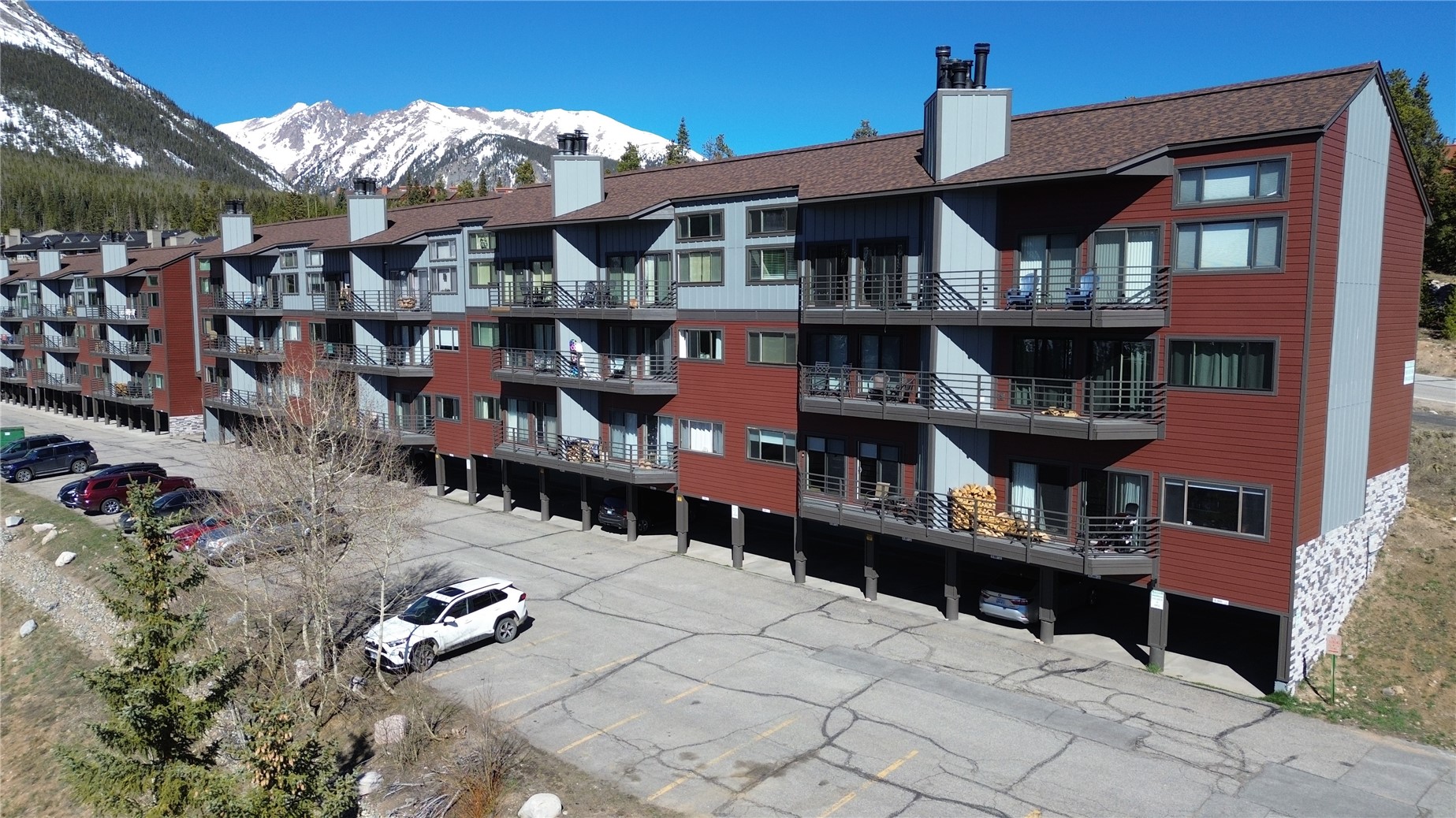 9800 Ryan Gulch Road, Unit 108 Silverthorne, CO 80498 - Photo 3 of 33 a front view of a building with glass windows