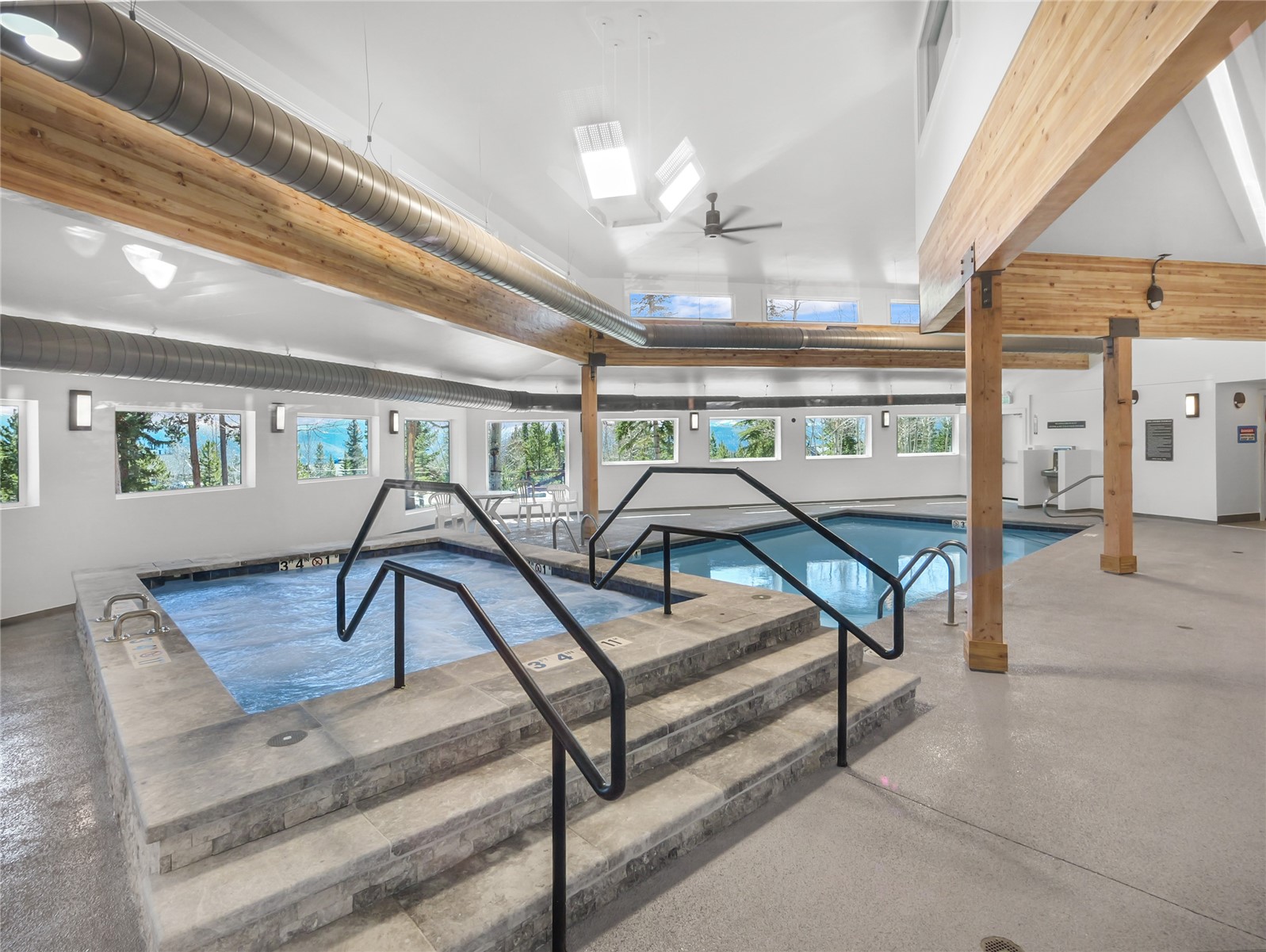 9800 Ryan Gulch Road, Unit 108 Silverthorne, CO 80498 - Photo 33 of 33 a bedroom with furniture and a ceiling fan