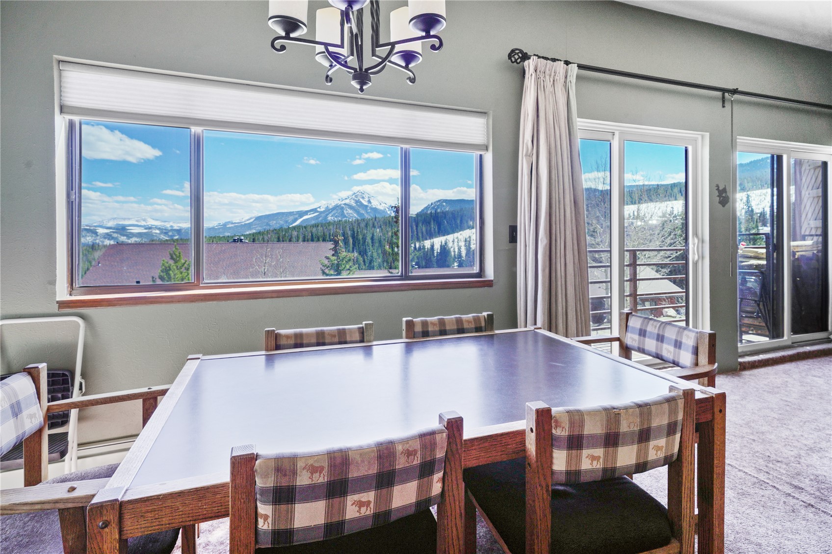 9800 Ryan Gulch Road, Unit 108 Silverthorne, CO 80498 - Photo 6 of 33 a dining room with furniture and window