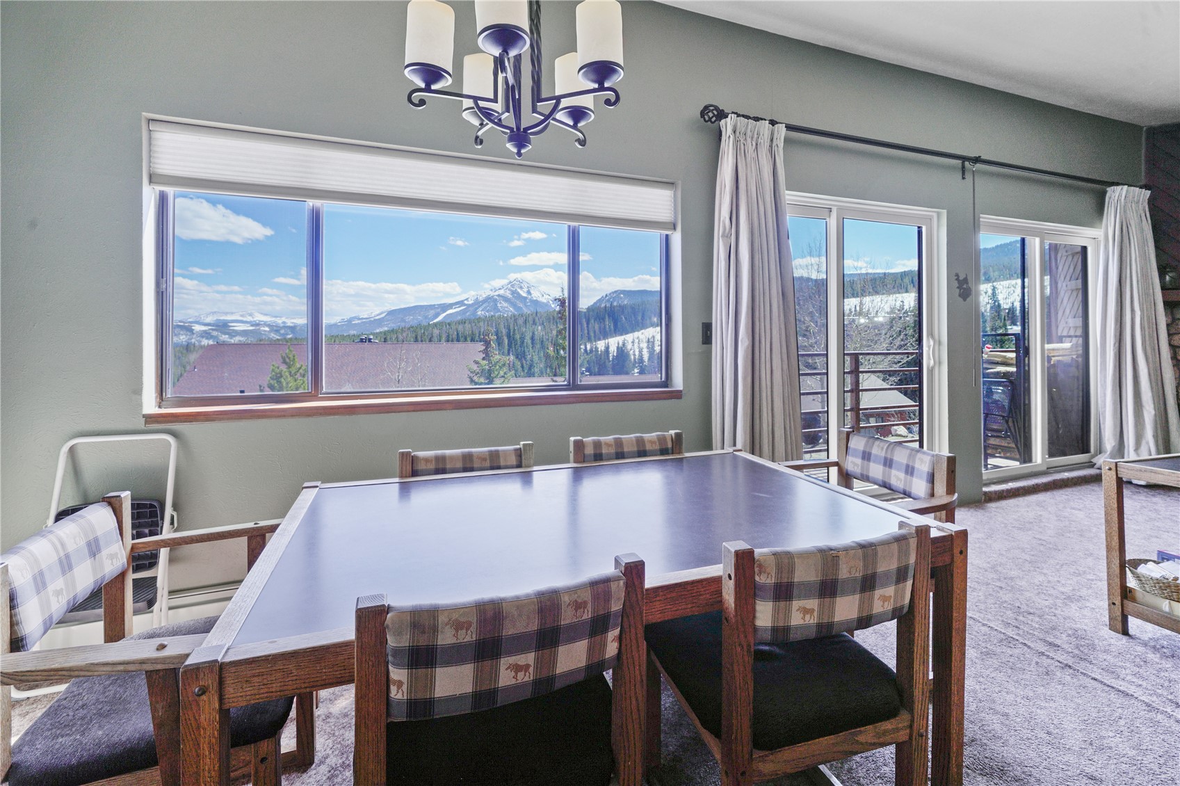 9800 Ryan Gulch Road, Unit 108 Silverthorne, CO 80498 - Photo 7 of 33 a dining room with furniture and window