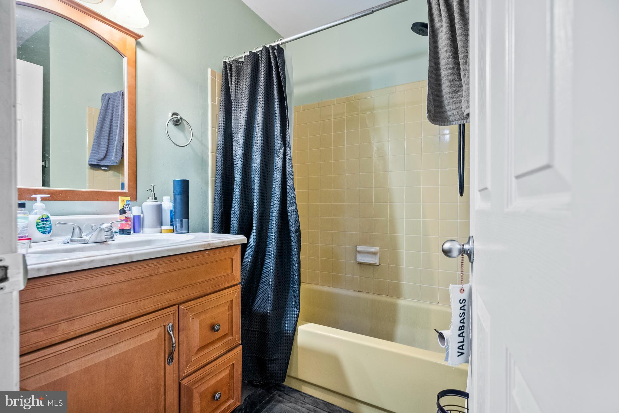 29 Sycamore Court Lumberton, NJ 08048 - Photo 12 of 15 a bathroom with a shower sink and mirror