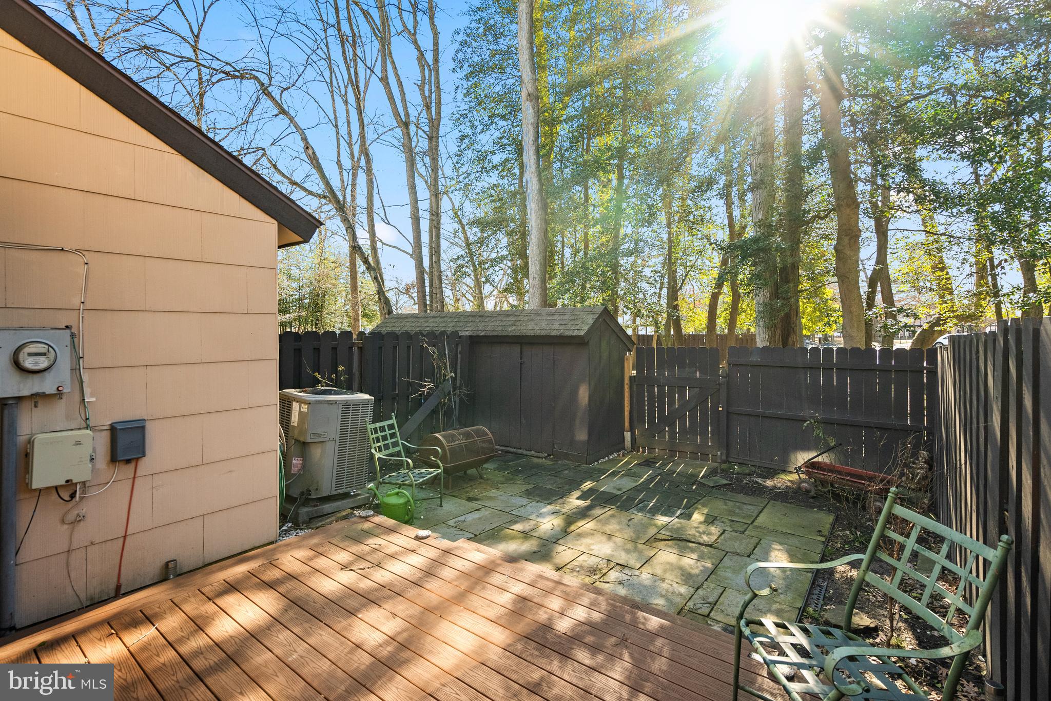 29 Sycamore Court Lumberton, NJ 08048 - Photo 13 of 15 a backyard of a house with large trees and wooden fence