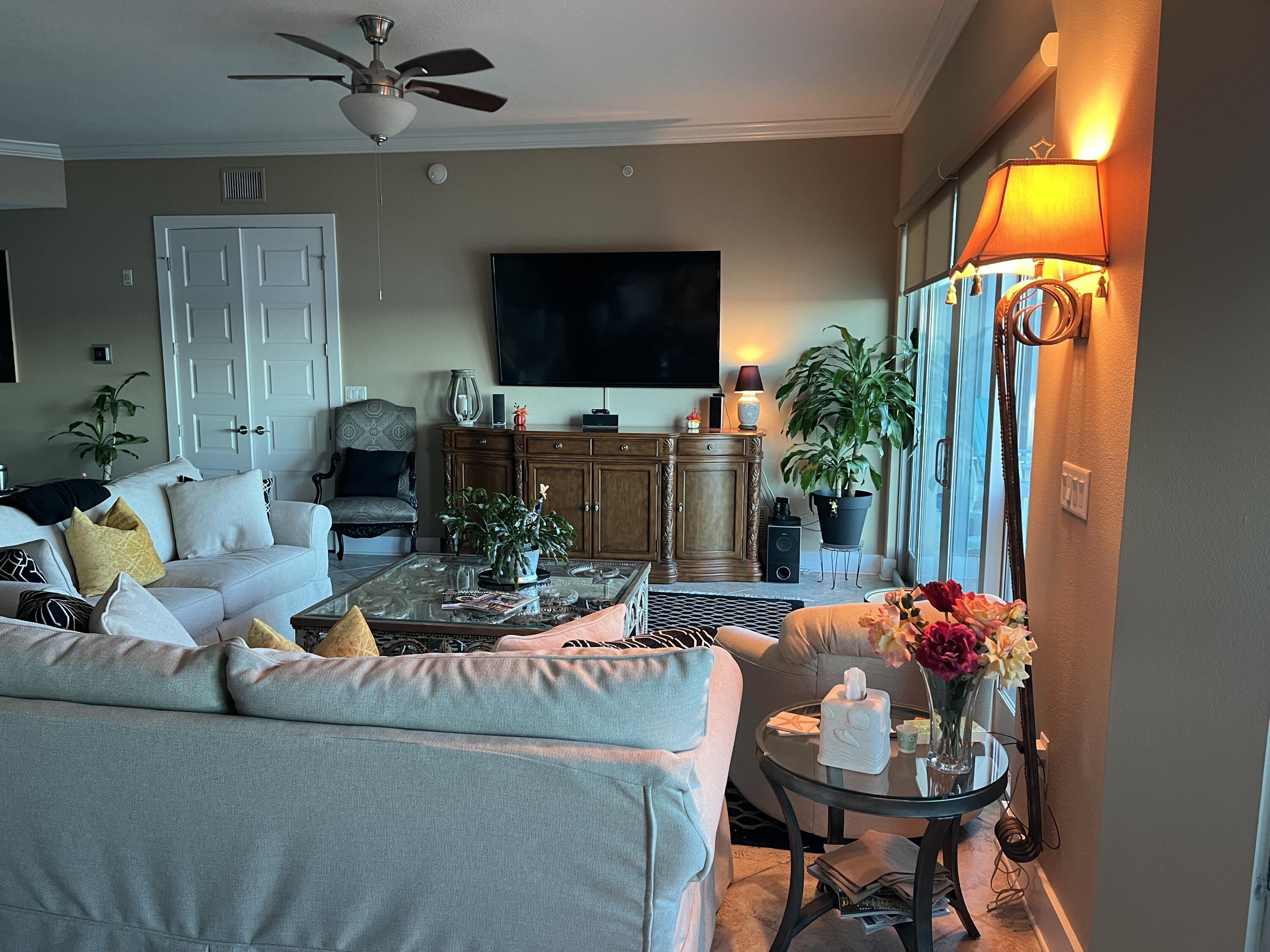 211 Durango Road, Unit 414 Destin, FL 32541 - Photo 12 of 50 a living room with furniture and a flat screen tv