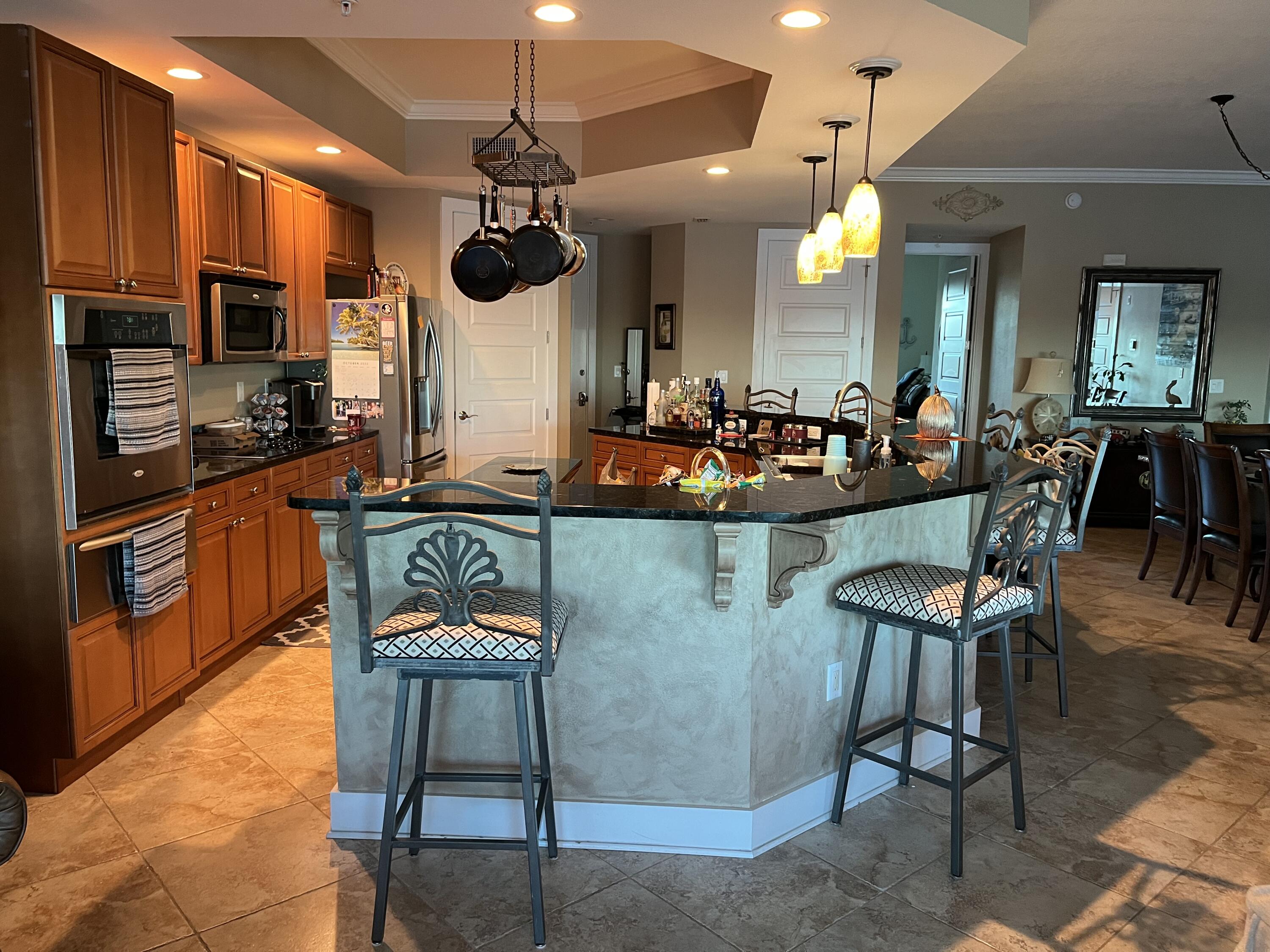 211 Durango Road, Unit 414 Destin, FL 32541 - Photo 17 of 50 a view of a dining room kitchen and furniture