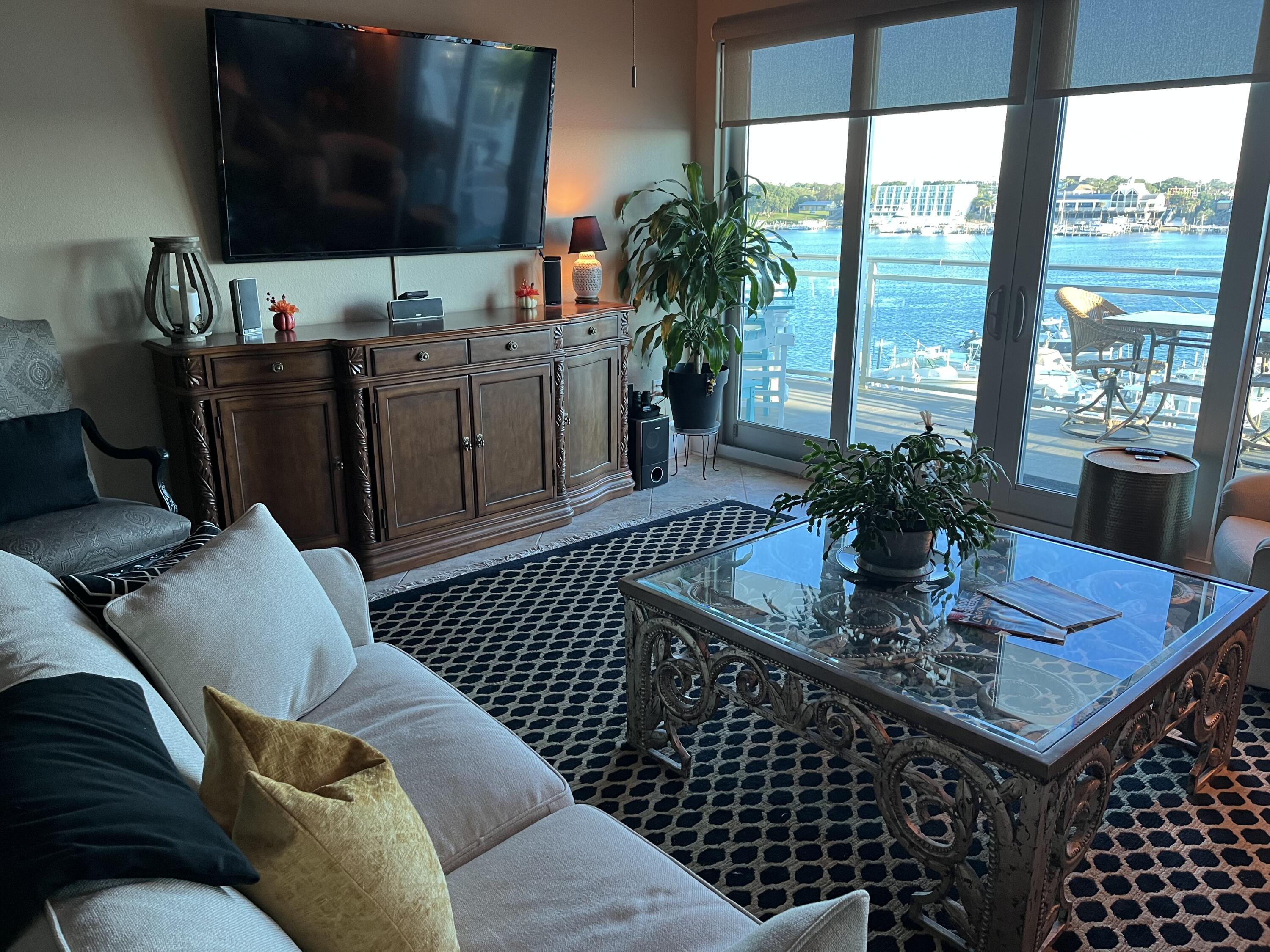 211 Durango Road, Unit 414 Destin, FL 32541 - Photo 19 of 50 a dining room with furniture and a potted plant