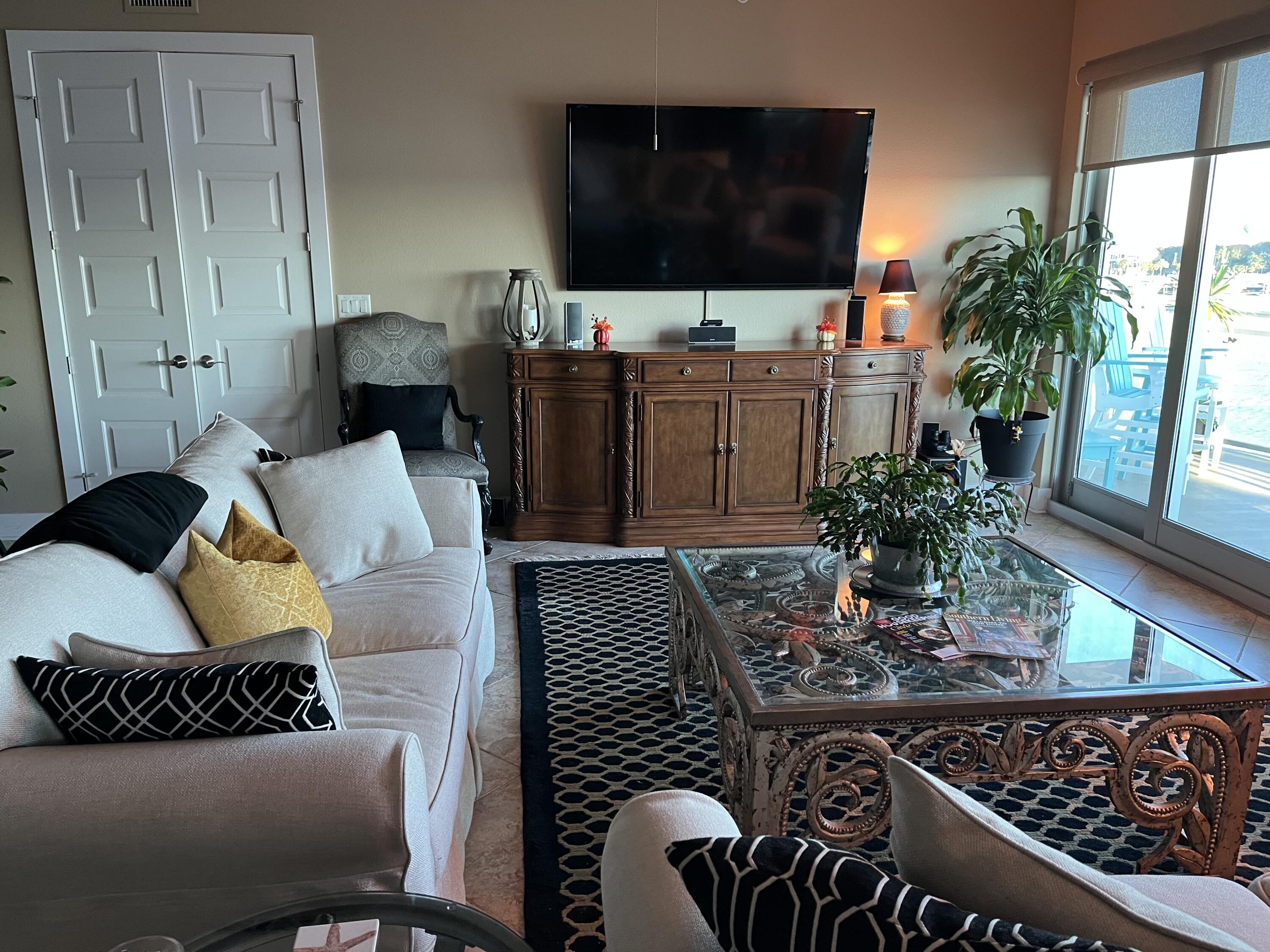 211 Durango Road, Unit 414 Destin, FL 32541 - Photo 20 of 50 a living room with furniture and a flat screen tv