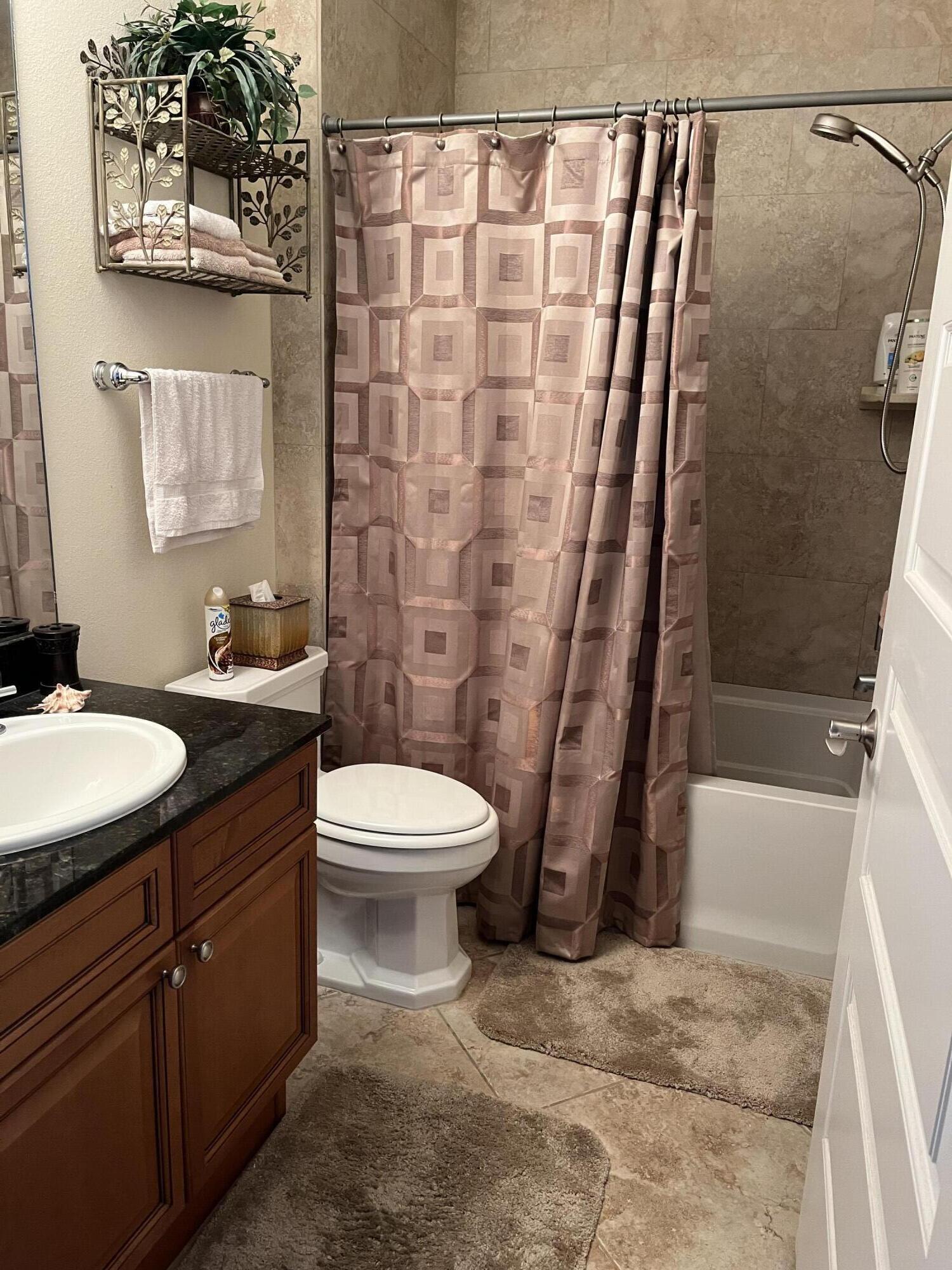 211 Durango Road, Unit 414 Destin, FL 32541 - Photo 26 of 50 a bathroom with a sink a toilet and shower