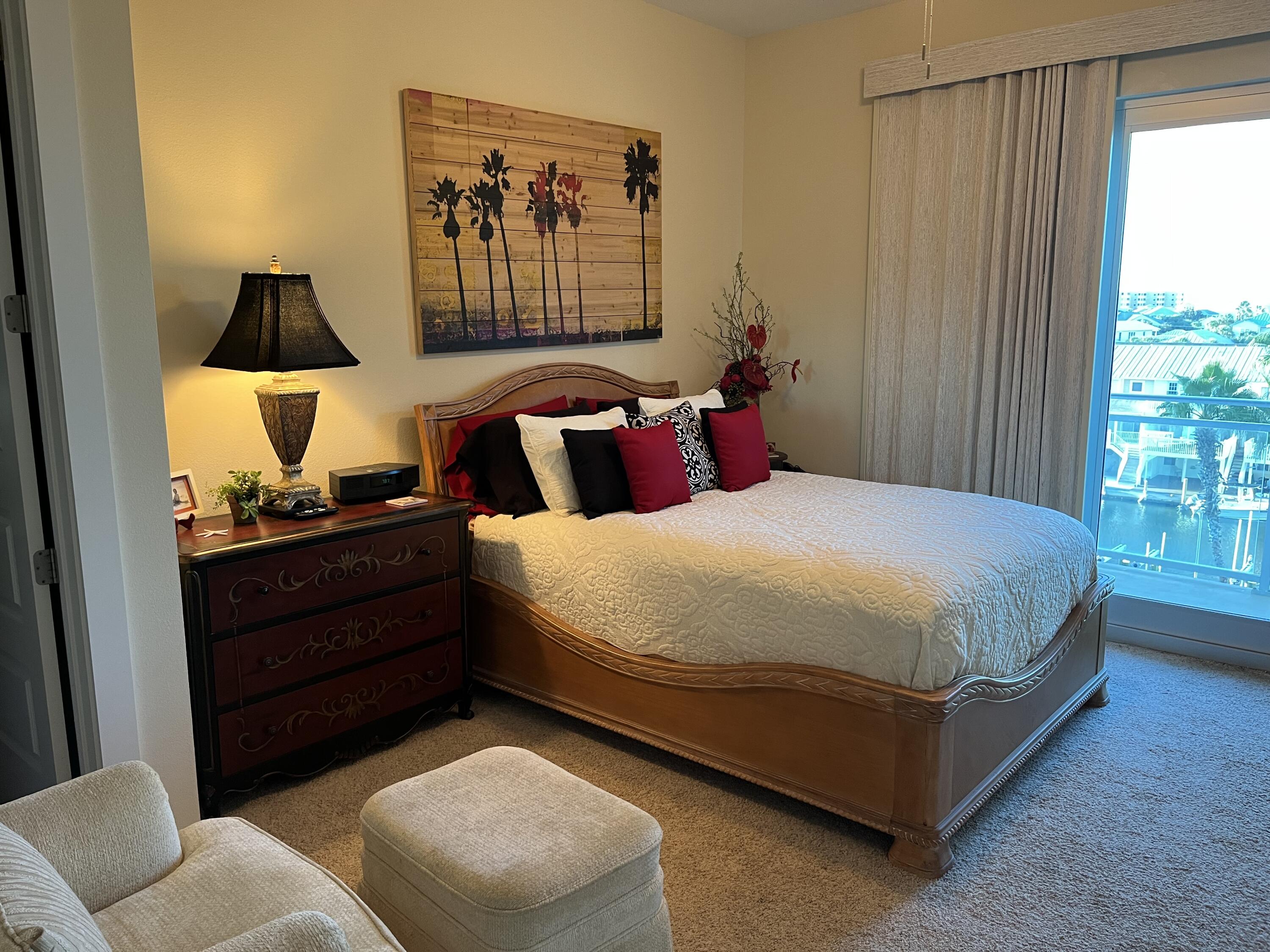 211 Durango Road, Unit 414 Destin, FL 32541 - Photo 28 of 50 a bed room with a bed and a window