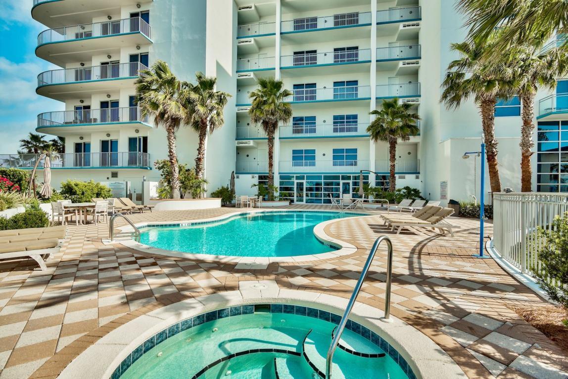 211 Durango Road, Unit 414 Destin, FL 32541 - Photo 38 of 50 a view of a swimming pool with a lounge chairs