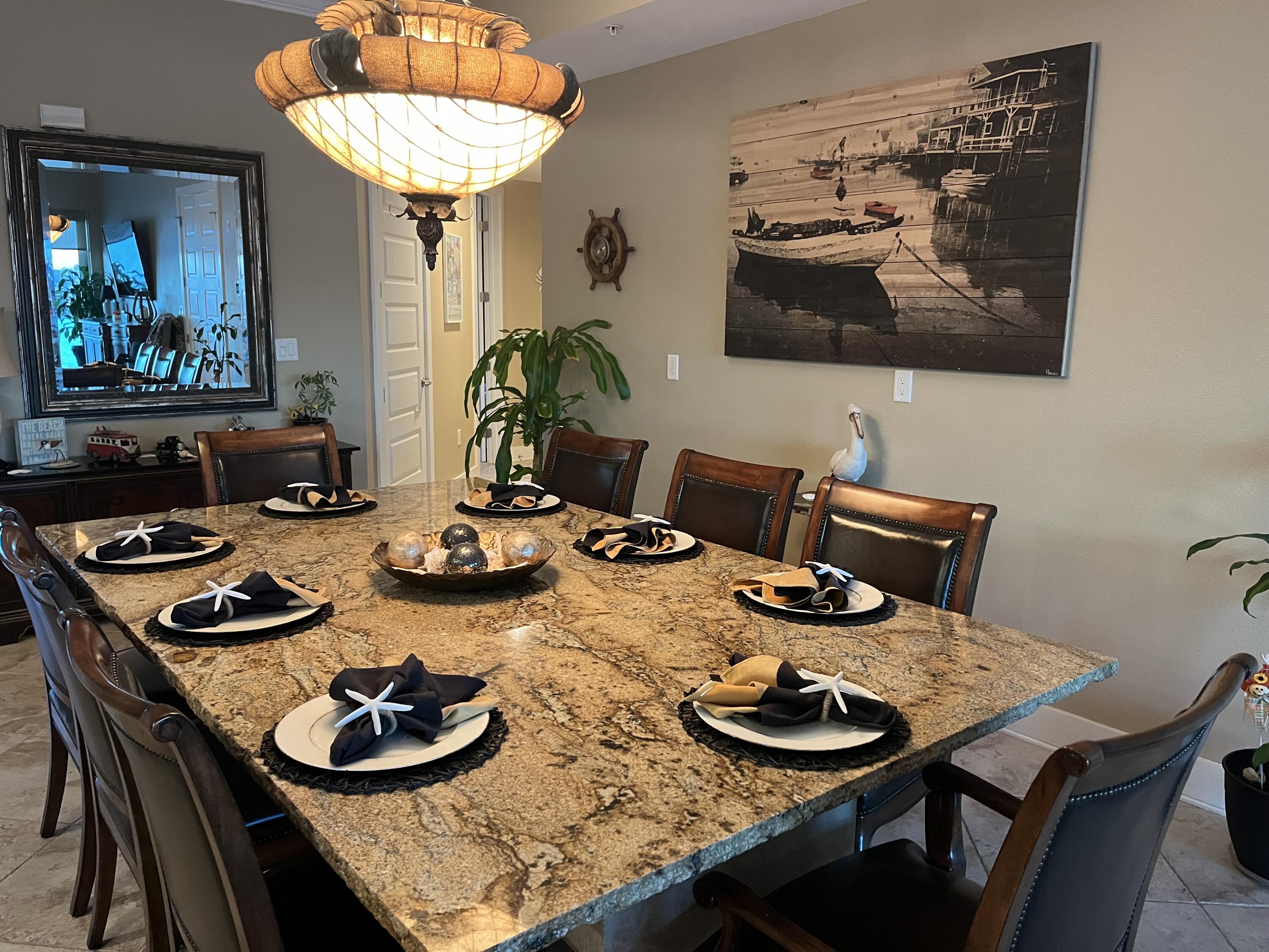 211 Durango Road, Unit 414 Destin, FL 32541 - Photo 6 of 50 a table and chairs in a dining room