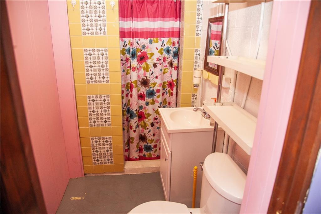 641 Morgantown Road Uniontown, PA 15401 - Photo 23 of 38 a bathroom with a toilet and a shower curtain