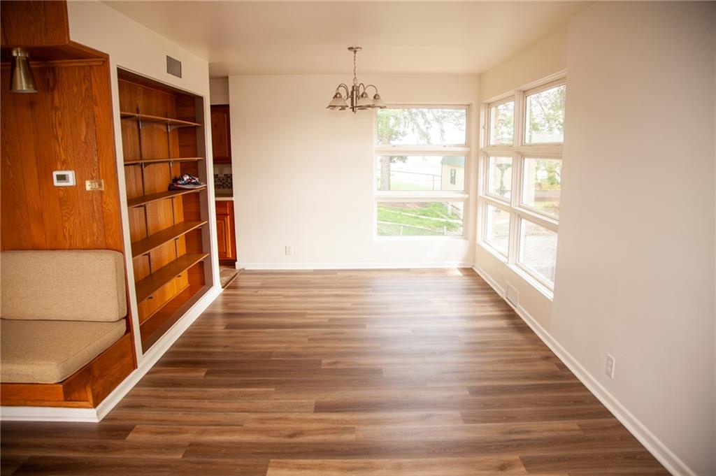 641 Morgantown Road Uniontown, PA 15401 - Photo 7 of 38 a view of an empty room with wooden floor and a window