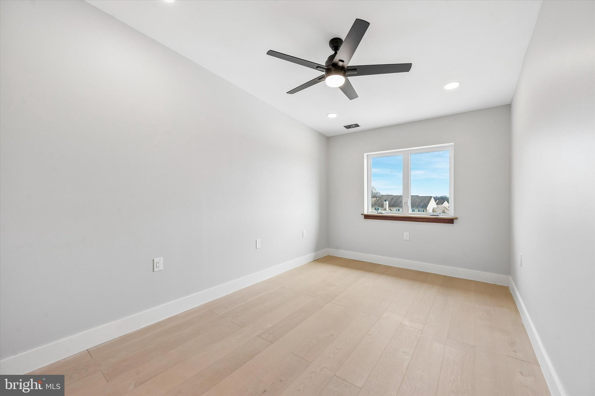 449 Greenridge Road Glenmoore, PA 19343 - Photo 11 of 21 an empty room with a window and a ceiling fan