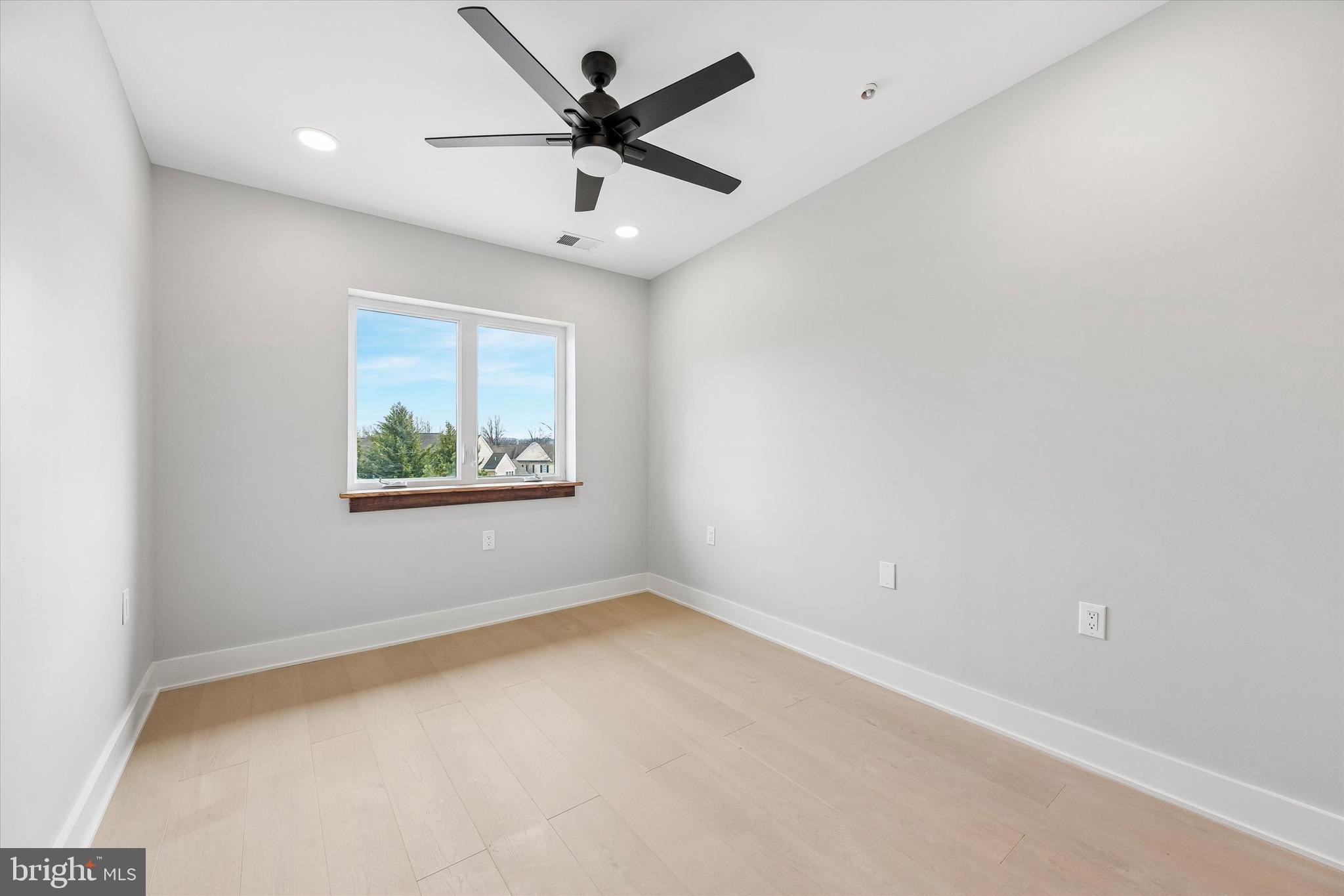 449 Greenridge Road Glenmoore, PA 19343 - Photo 15 of 21 an empty room with a window and a ceiling fan