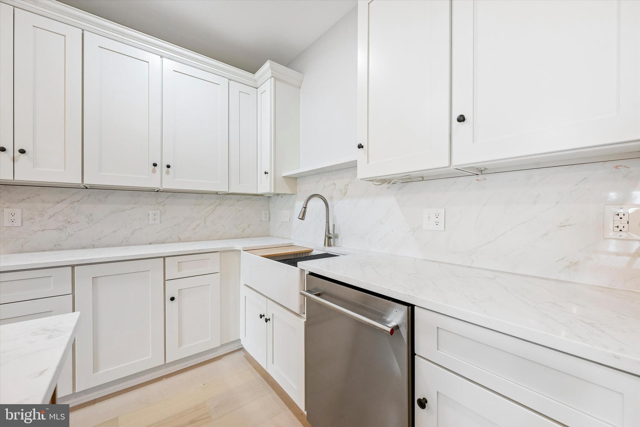 449 Greenridge Road Glenmoore, PA 19343 - Photo 4 of 21 a kitchen with white cabinets and sink