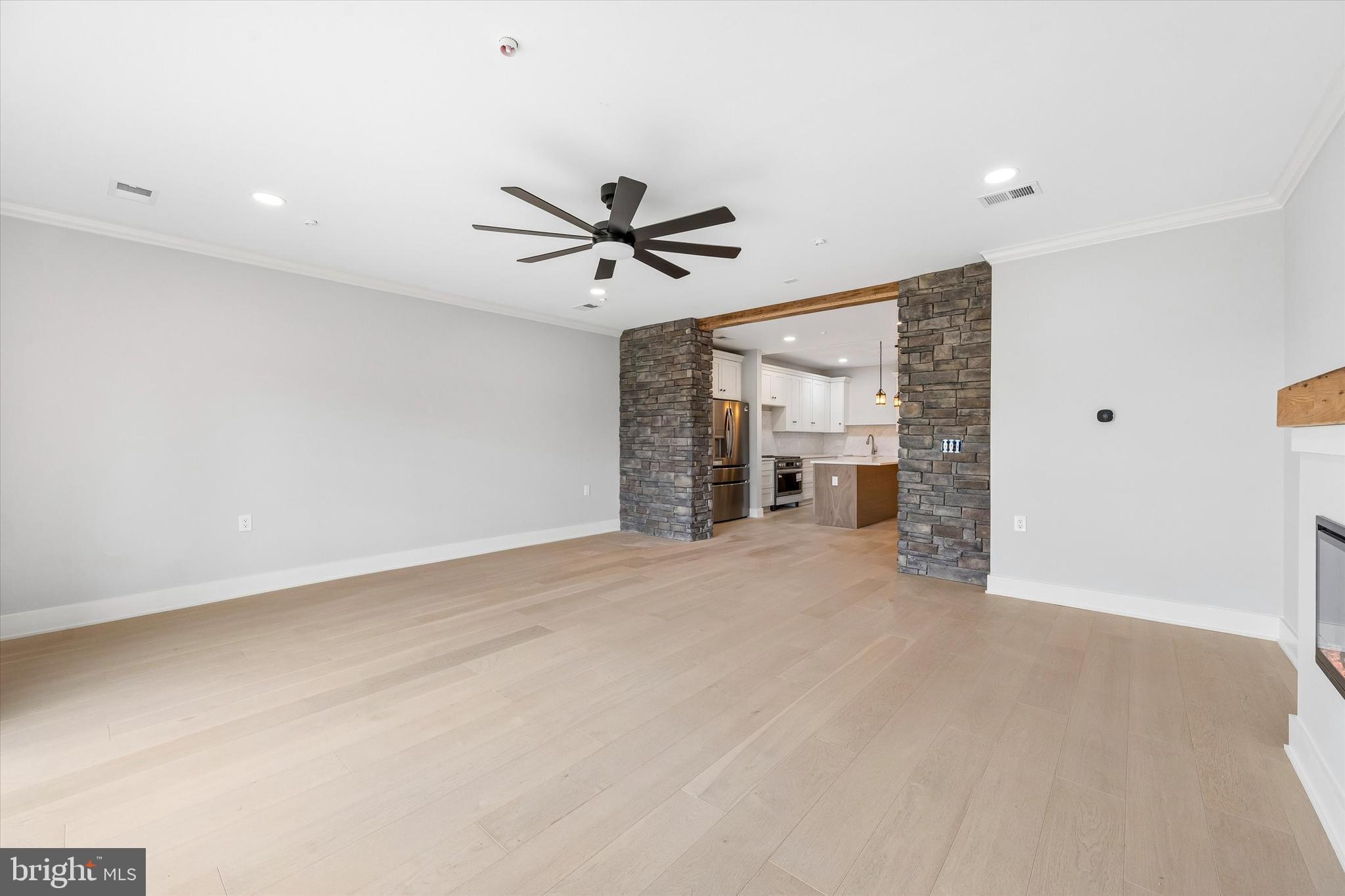 449 Greenridge Road Glenmoore, PA 19343 - Photo 7 of 21 an empty room with a ceiling fan and window