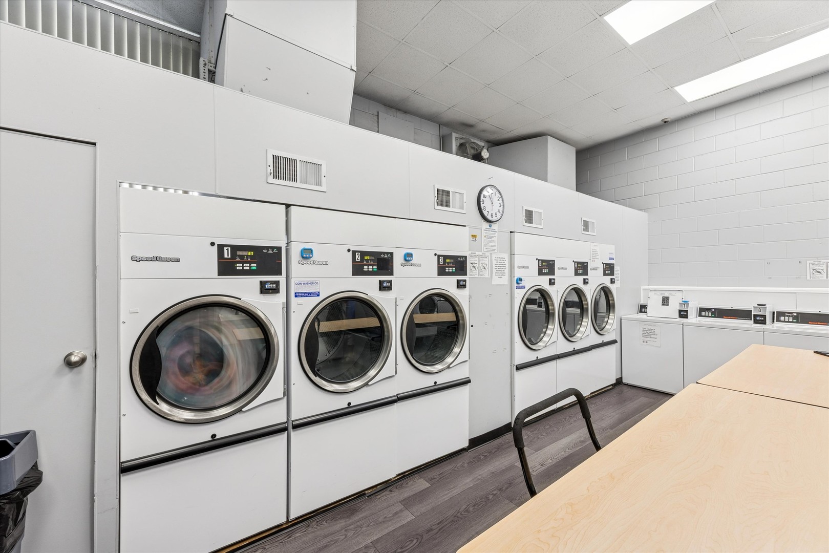 20 North Tower Road, Unit 12L Oak Brook, IL 60523 - Photo 13 of 16 a utility room with dryer washer and a view of living room