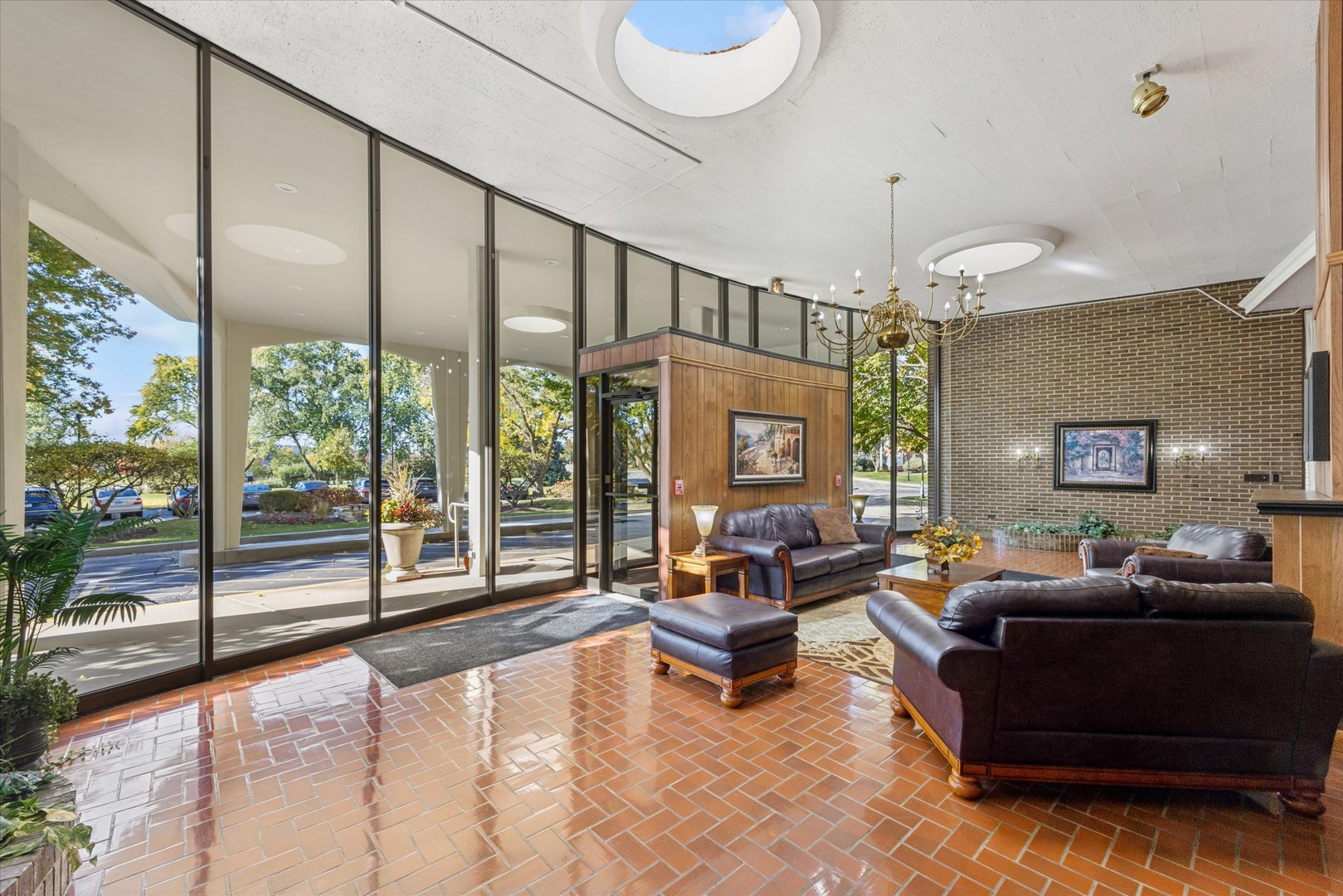 20 North Tower Road, Unit 12L Oak Brook, IL 60523 - Photo 14 of 16 a living room with furniture and a large window